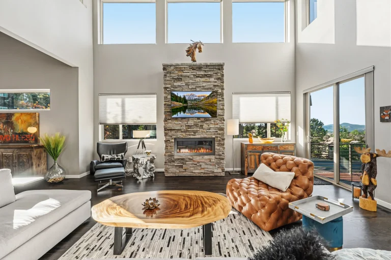Two-story great room with stone fireplace