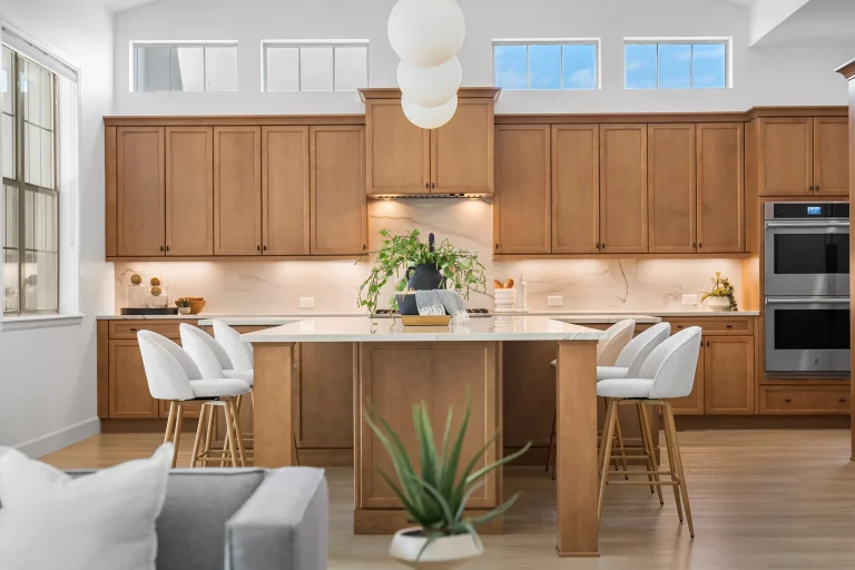 Wood kitchen with large island and pendant lights