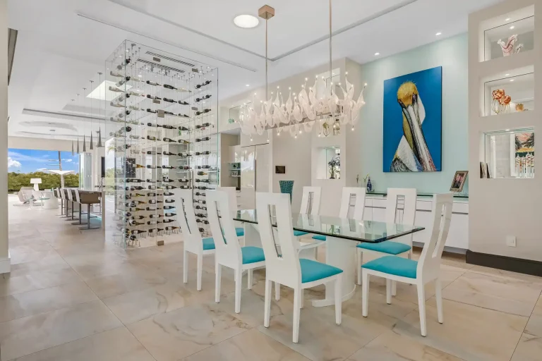 Dining room with crystal chandelier and glass-block wall