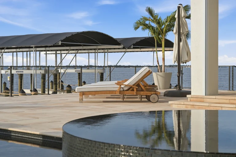 Infinity pool with lounge chair and palm trees in Florida