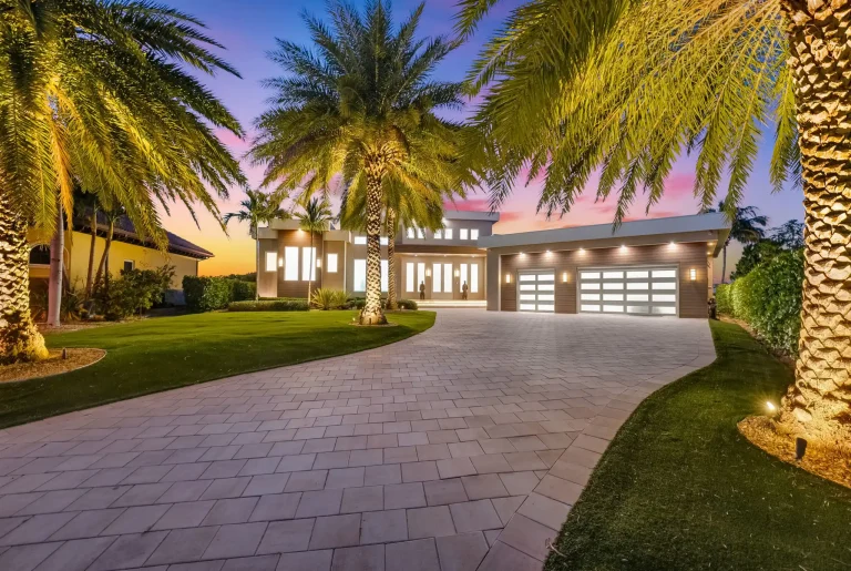 Twilight driveway and palm trees at a Florida home
