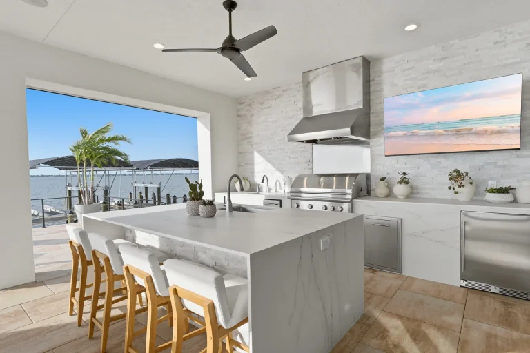 Kitchen with waterfall island and water view