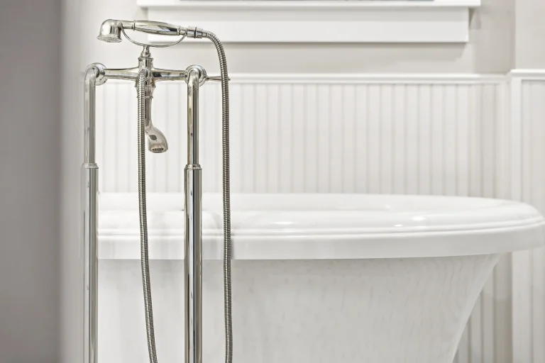 Freestanding tub with floor-mounted faucet