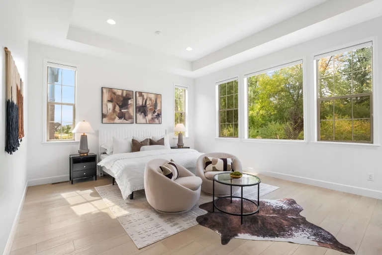 Bedroom with sitting area and garden windows