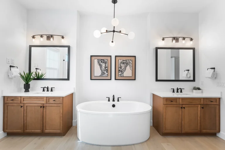 Bathroom with round soaking tub between two vanities