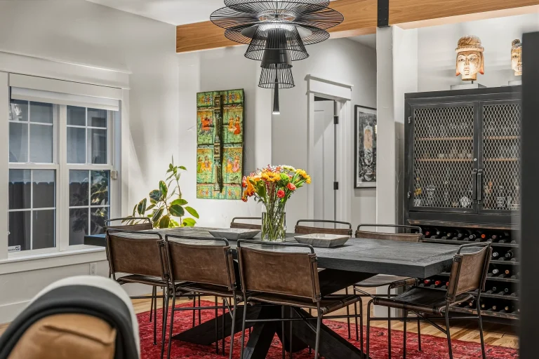 Dining area with flowers and wine cabinet