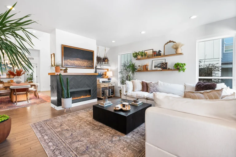 Bright modern living room with fireplace and built-in shelves